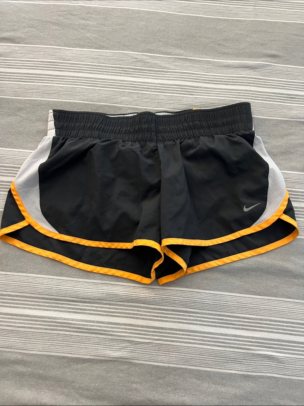 Nike Black Athletic Shorts with Yellow Trim and White Panels